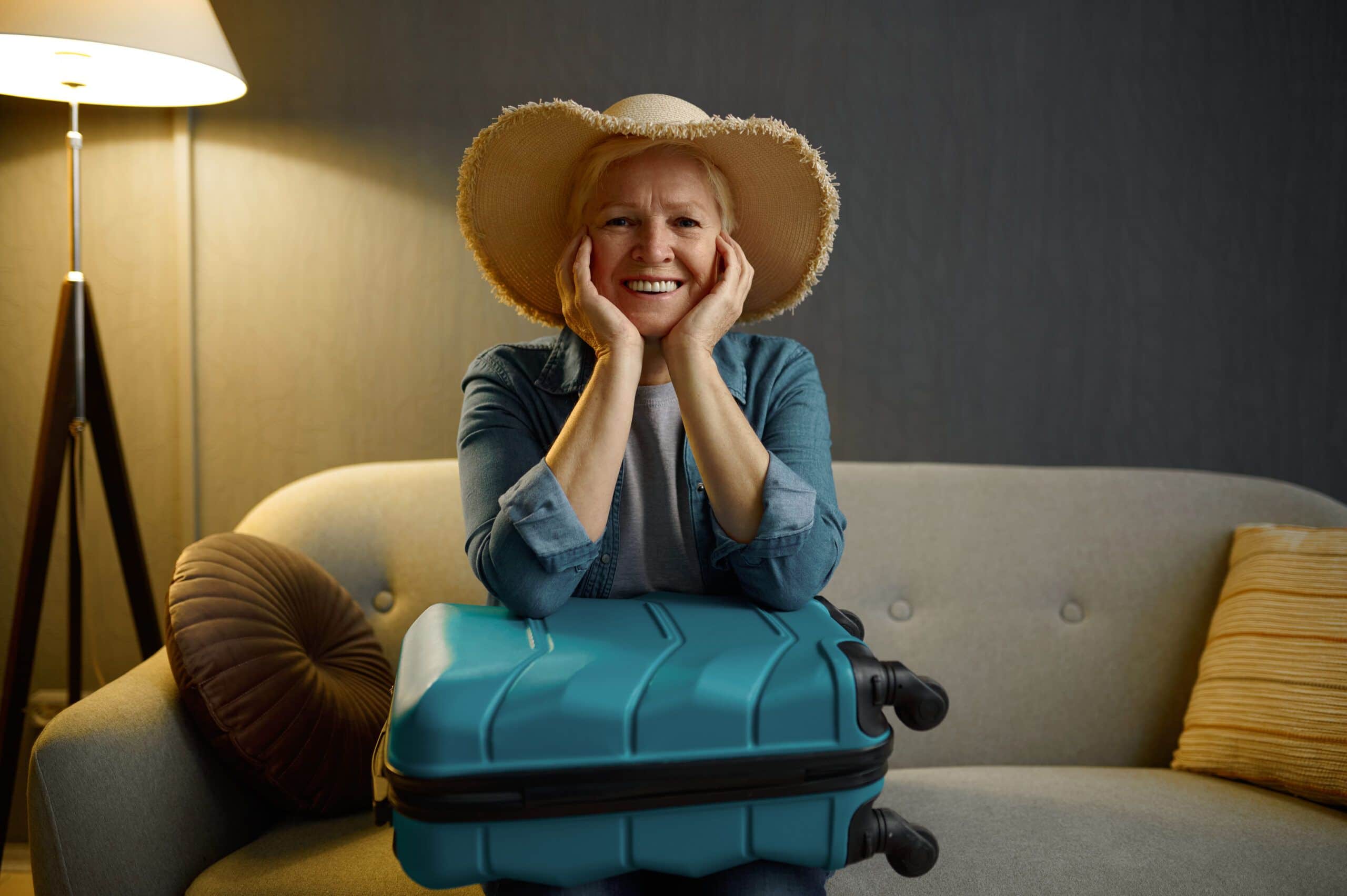 Smiling aged woman tourist looking at camera