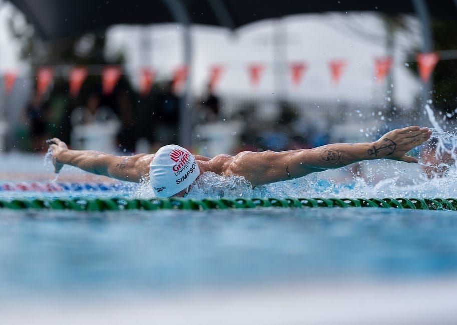 Cody Simpson swimming in Butterfly race