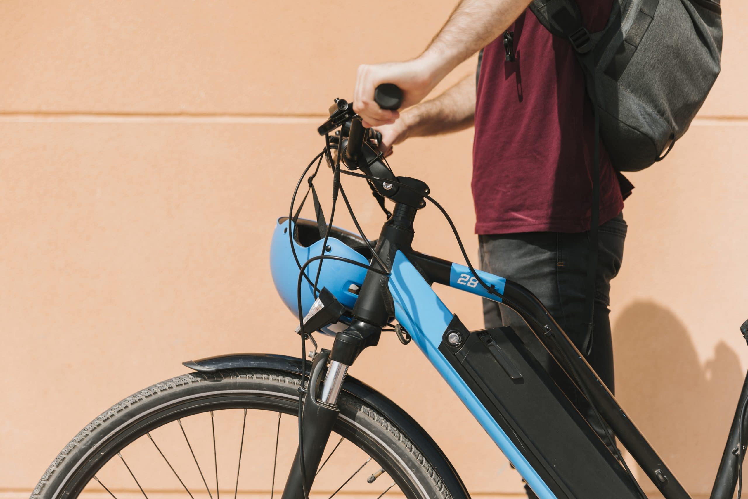 sideways-cyclist-standing-e-bike