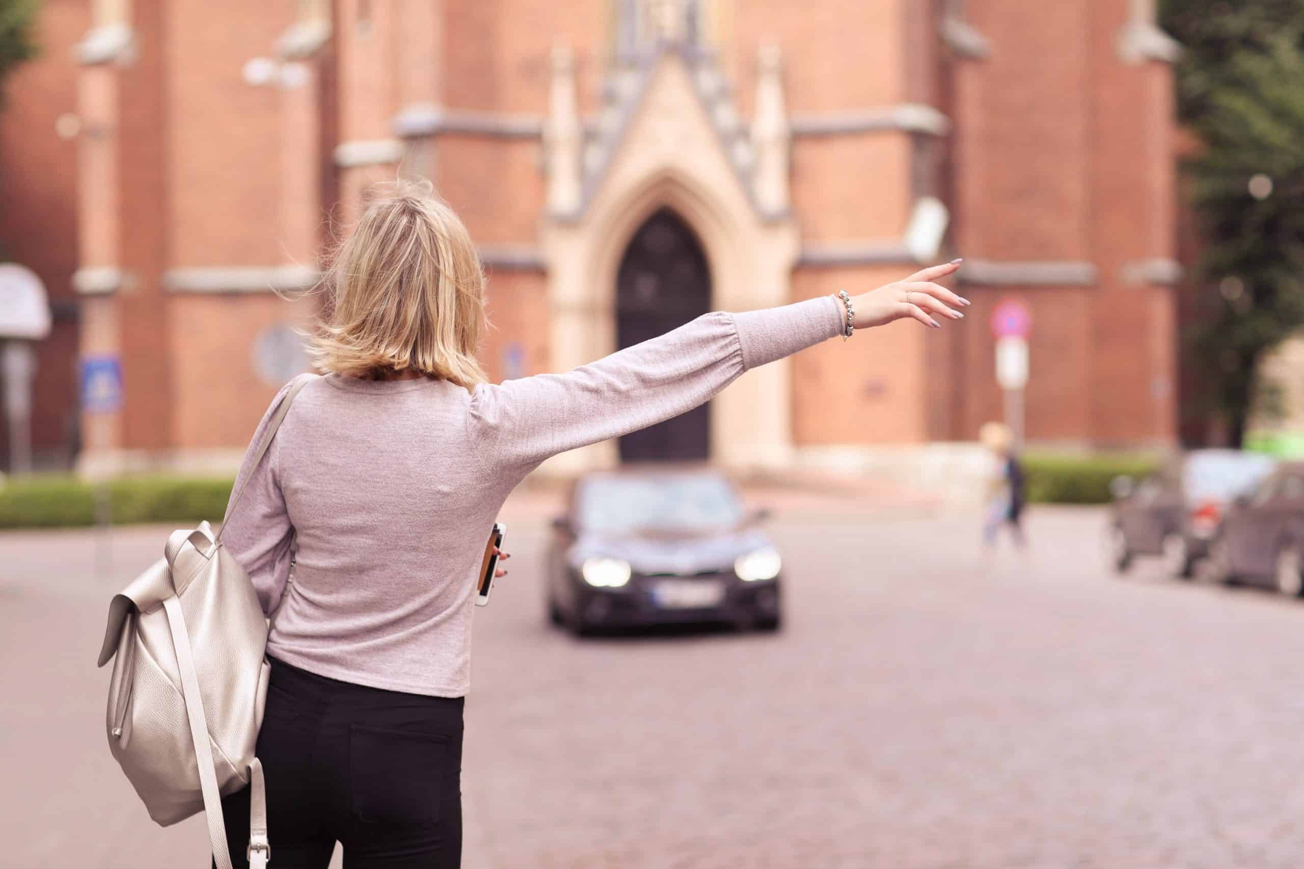 Woman hailing ride