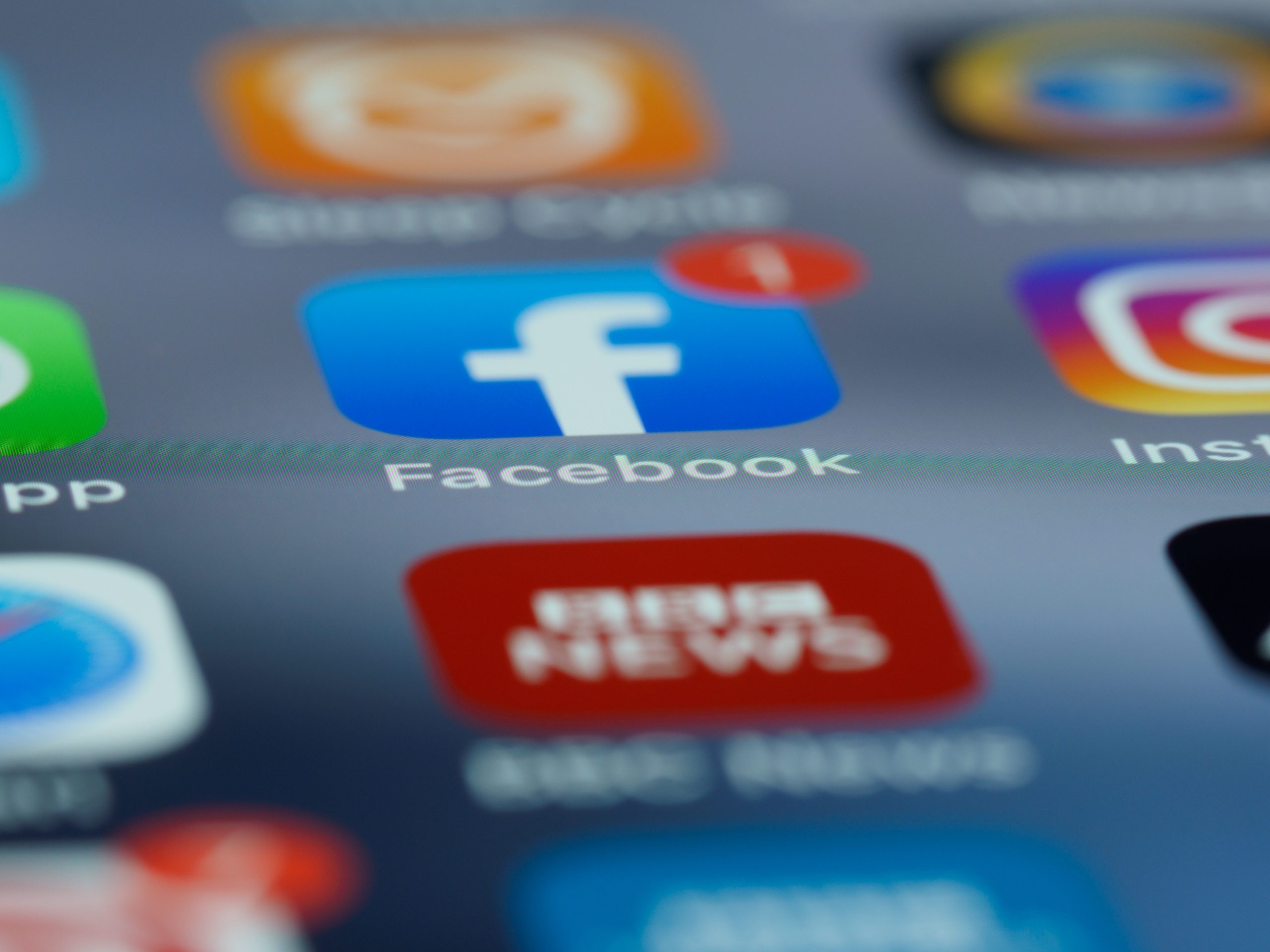 Smartphone screen with facebook and instagram apps.