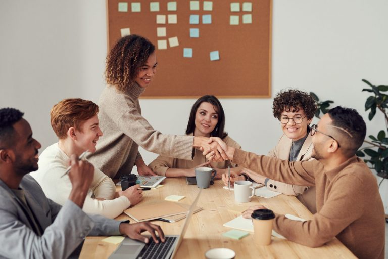 Group of people working together. Source : Pexels