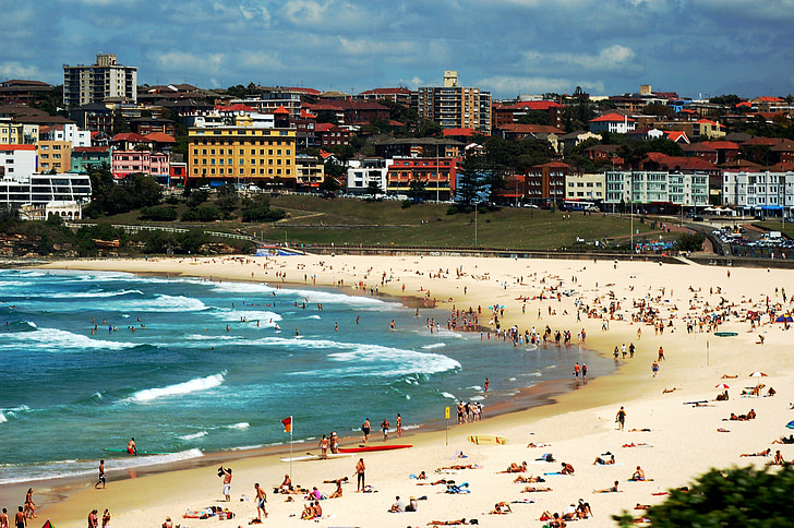 People flock to Bondi beach during Sydney heatwave.