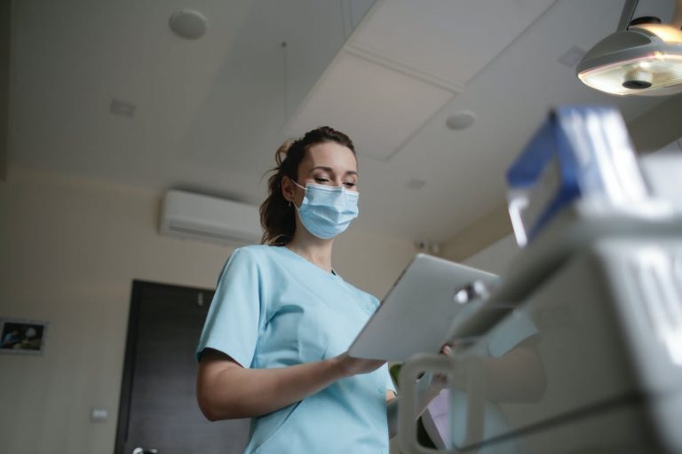 A nurse looks over a patient file