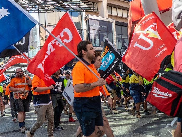 CFMEU protestors march in Brisbane's CBD in 2019.
