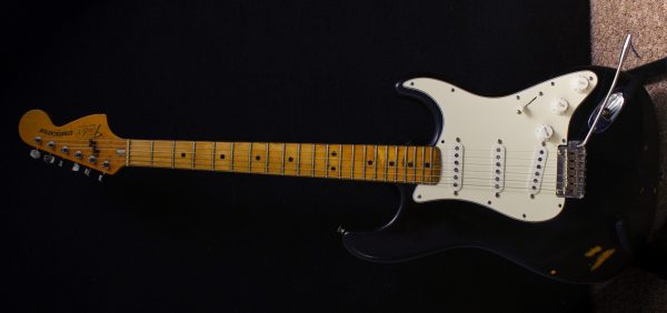 A new Fender Stratocaster, similar to auctioned guitar that Kurt Cobain smashed on stage.