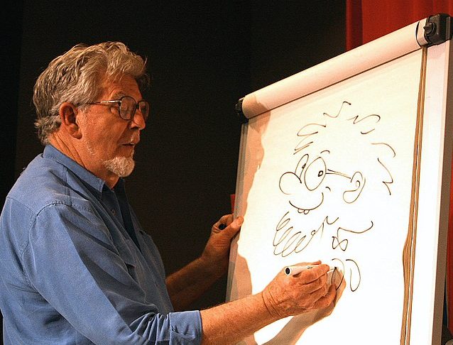 Rolf Harris sketches a self-portrait.