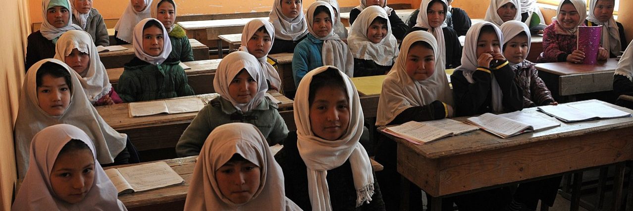 Young Afghan girls sit in their Aliabad School classroom near Mazar-e-Sharif, Afghanistan, March 10, 2012.