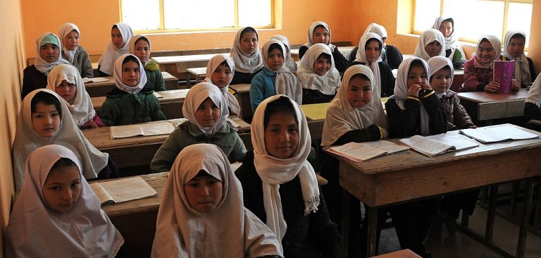 Young Afghan girls sit in their Aliabad School classroom near Mazar-e-Sharif, Afghanistan, March 10, 2012.