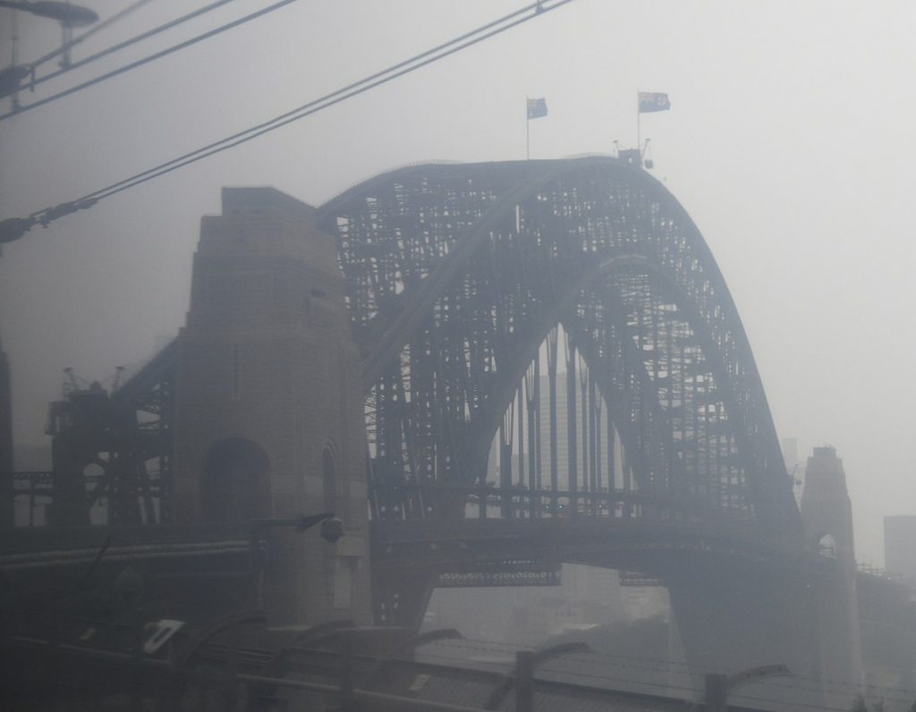 A blanket of smoke falls over Sydney after backburning.