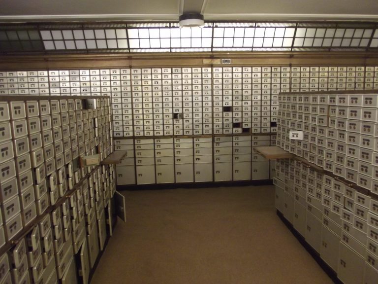 A bank vault with safety deposit boxes