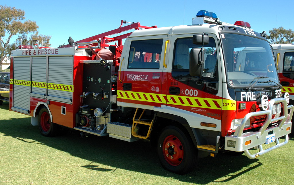 A FESA Isuzu fire truck vehicle parked on grass