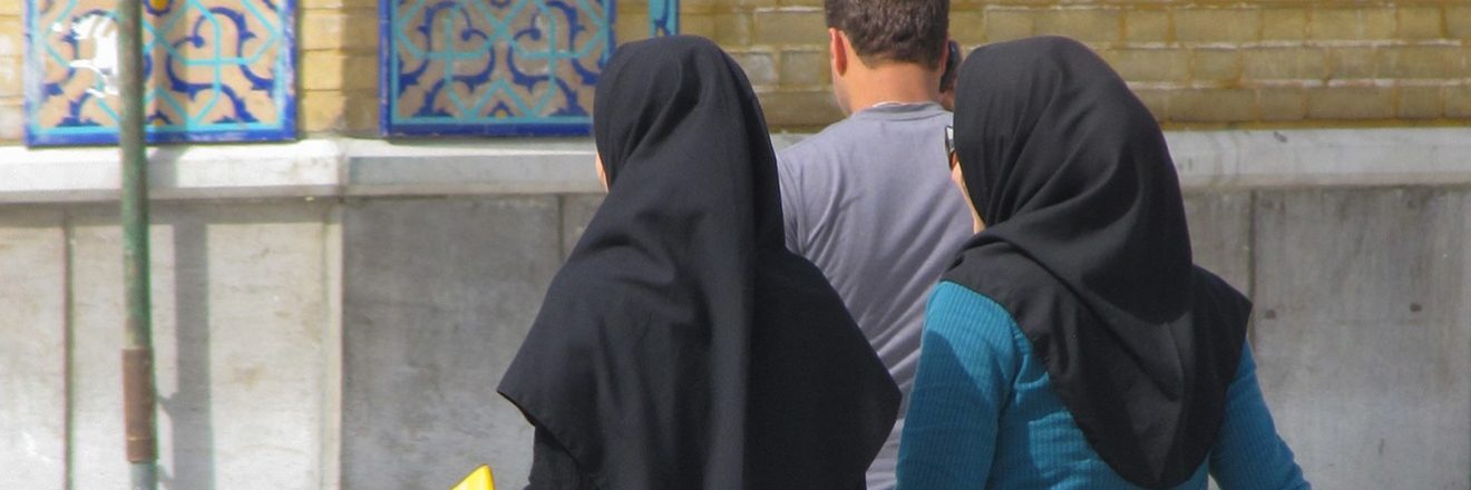 Two women in Iran wearing hijabs, as required by the morality police