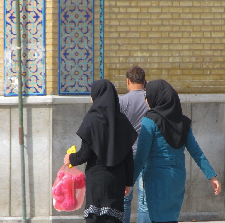 Two women in Iran wearing hijabs, as required by the morality police