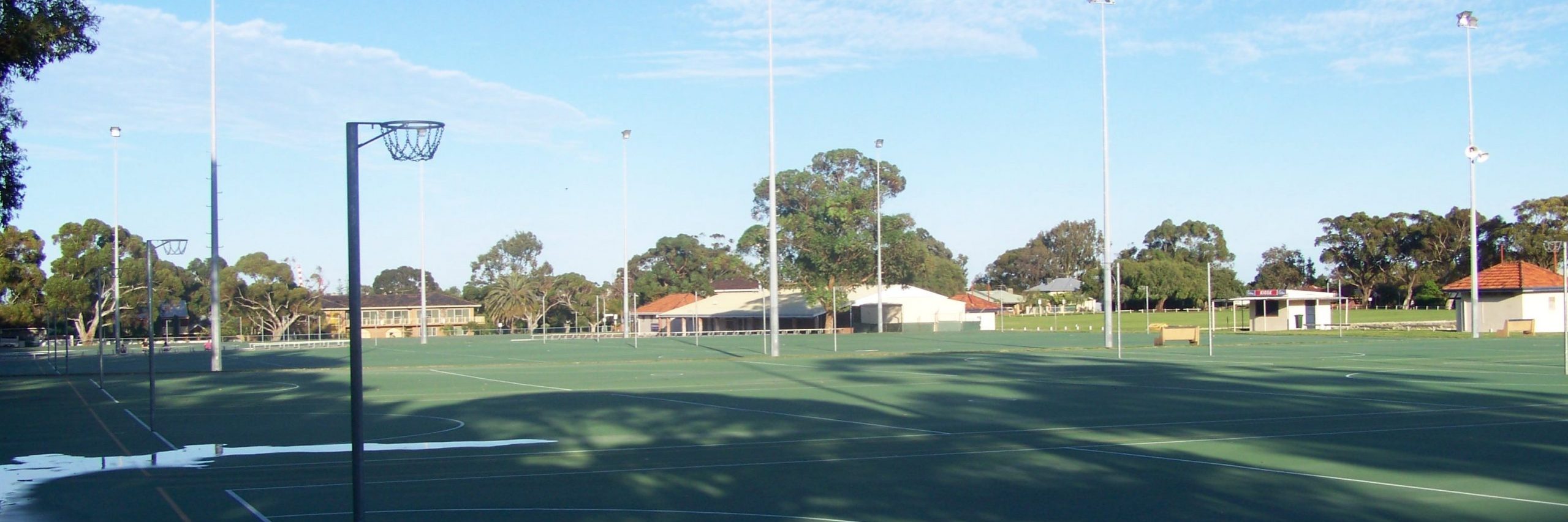 Empty netball courts covered with water