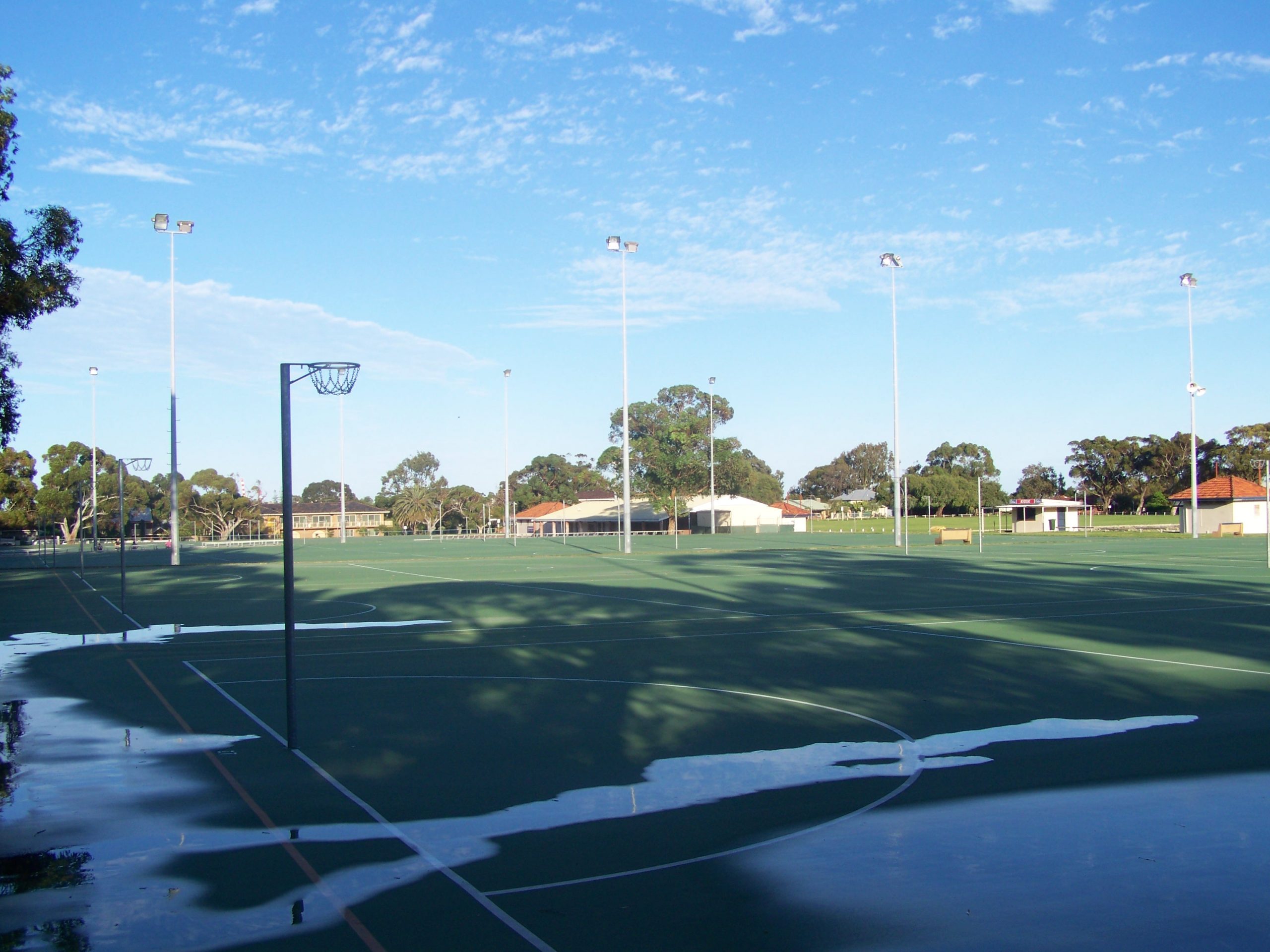 Empty netball courts covered with water