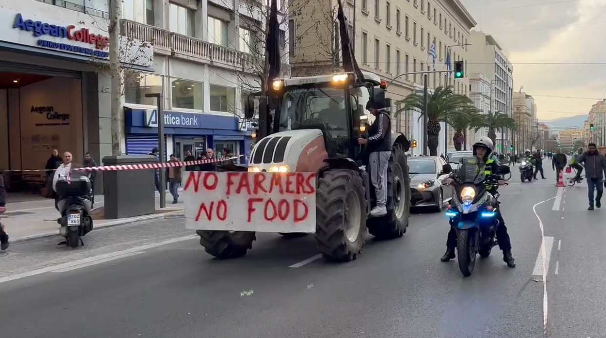 Truck on road with banner protesting