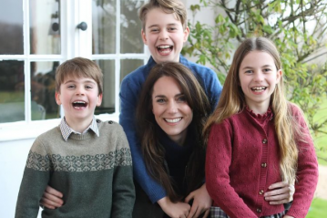 Princess Kate sitting with her three children.