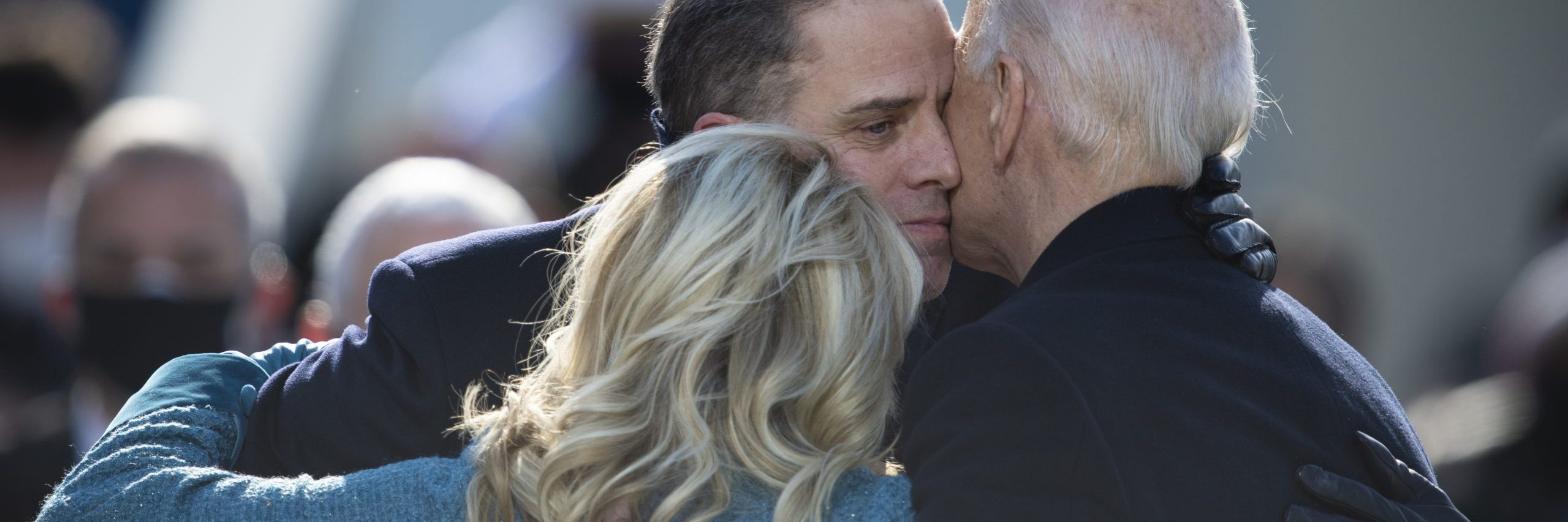 An image of US President Joe Biden hugging his family during the 59th Presidential Inauguration ceremony in Washington, Jan. 20, 2021. Image source: Chairman of the Joint Chiefs of Staff, via Wikimedia Commons