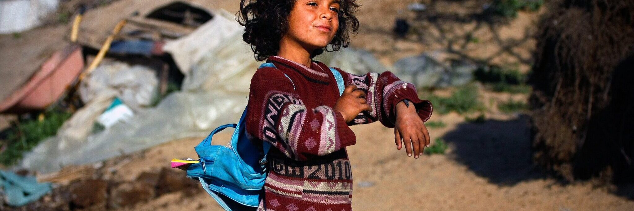 Sabha,6, getting ready to walk to school from her house on the borders eastern Gaza strip, where she and her family are still living in tents after Israeli war in Gaza.