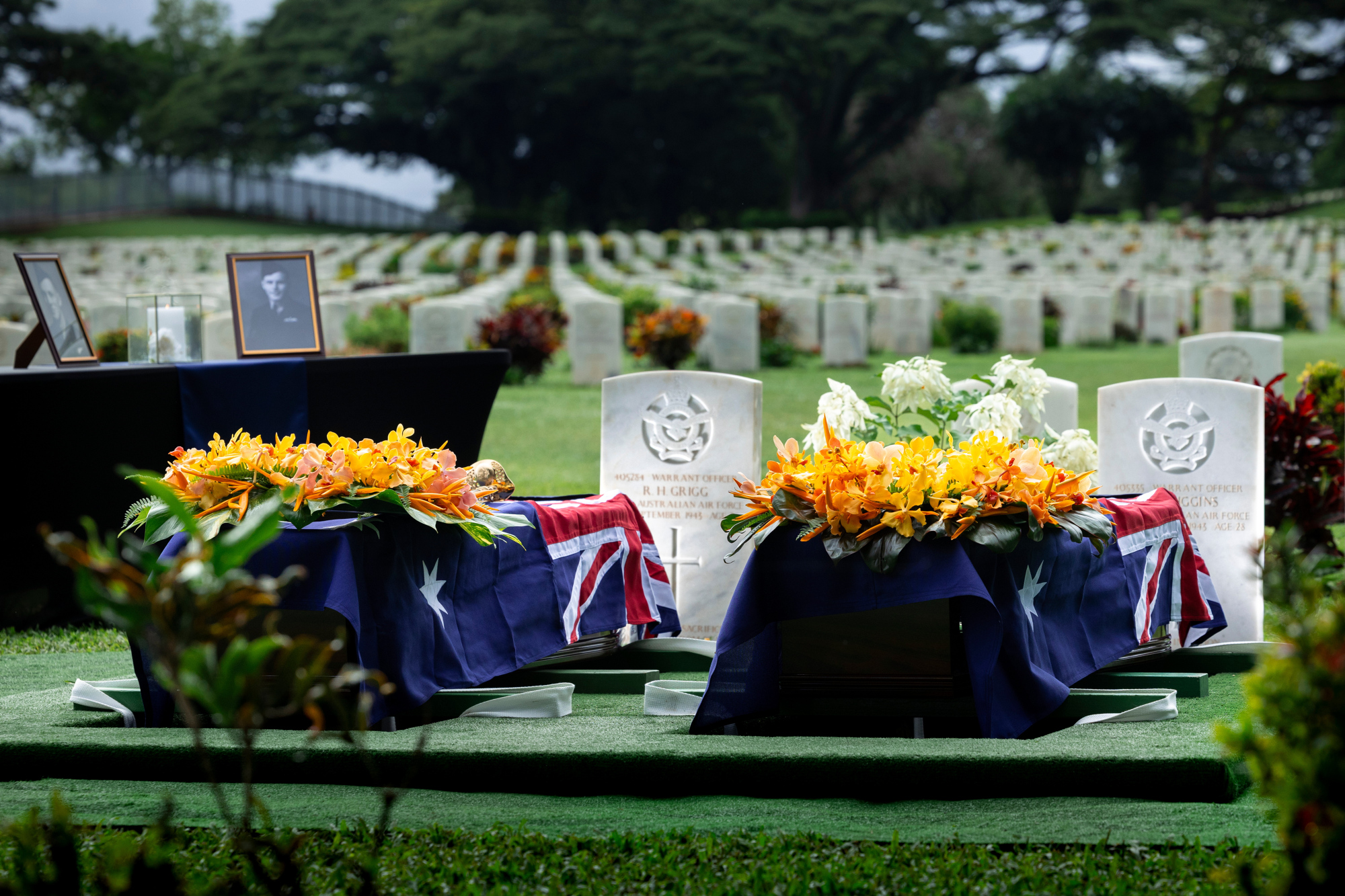 The caskets of warrant officers Russell Grigg and Clement Wiggins ready to be lowered at the Bomana War Cemetery, Port Moresby, PNG. Photo: Department of Defence