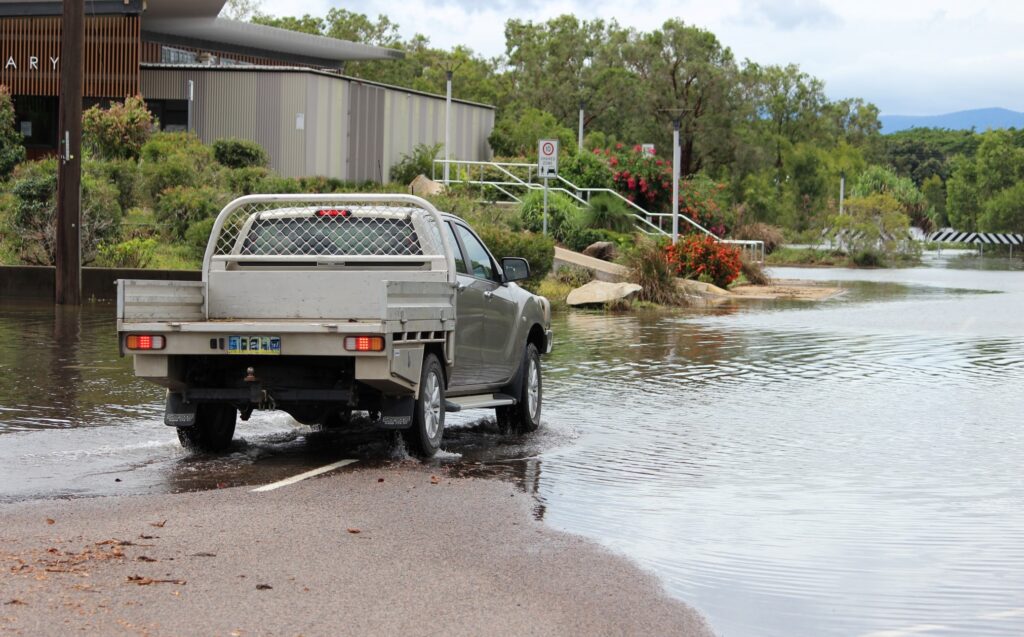 Flooding in Ingham in 2018. The driver stopped and reversed direction when he came across the flooding. Photo: ANDREW KACIMAIWAI
