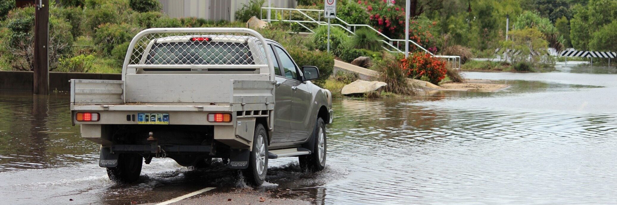 Flooding in Ingham in 2018. The driver stopped and reversed direction when he came across the flooding. Photo: ANDREW KACIMAIWAI