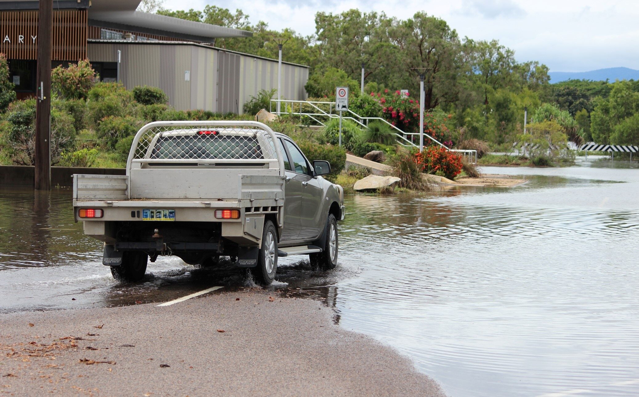 Flooding in Ingham in 2018. The driver stopped and reversed direction when he came across the flooding. Photo: ANDREW KACIMAIWAI