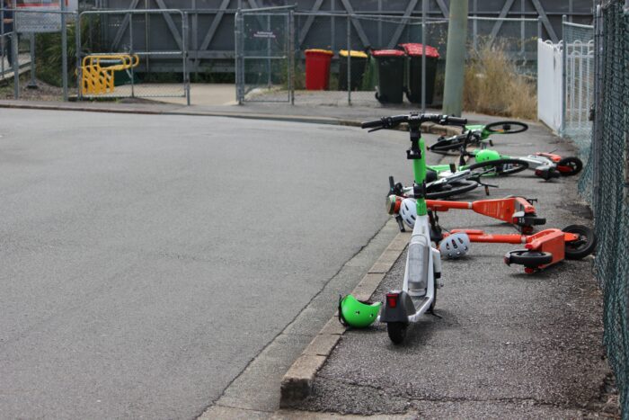 E-scooters net to a rail station in suburban Brisbane, Queensland. Photo: ANDREW KACIMAIWAI