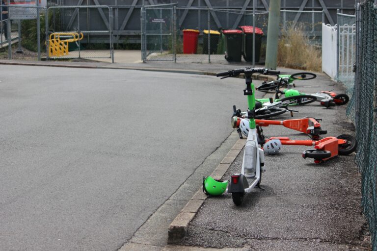 E-scooters net to a rail station in suburban Brisbane, Queensland. Photo: ANDREW KACIMAIWAI