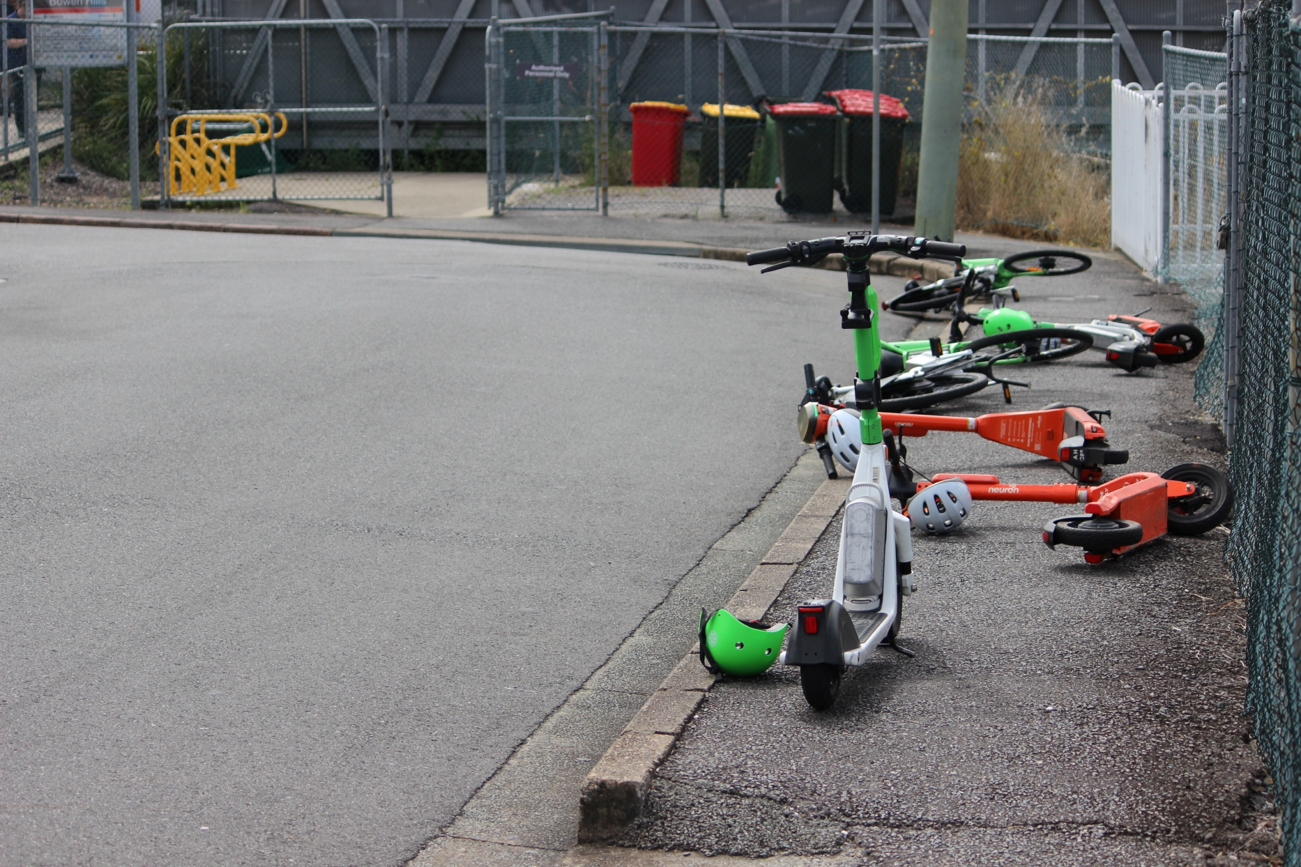 Electric scooters next to a rail station in suburban Brisbane, Queensland. Photo: ANDREW KACIMAIWAI