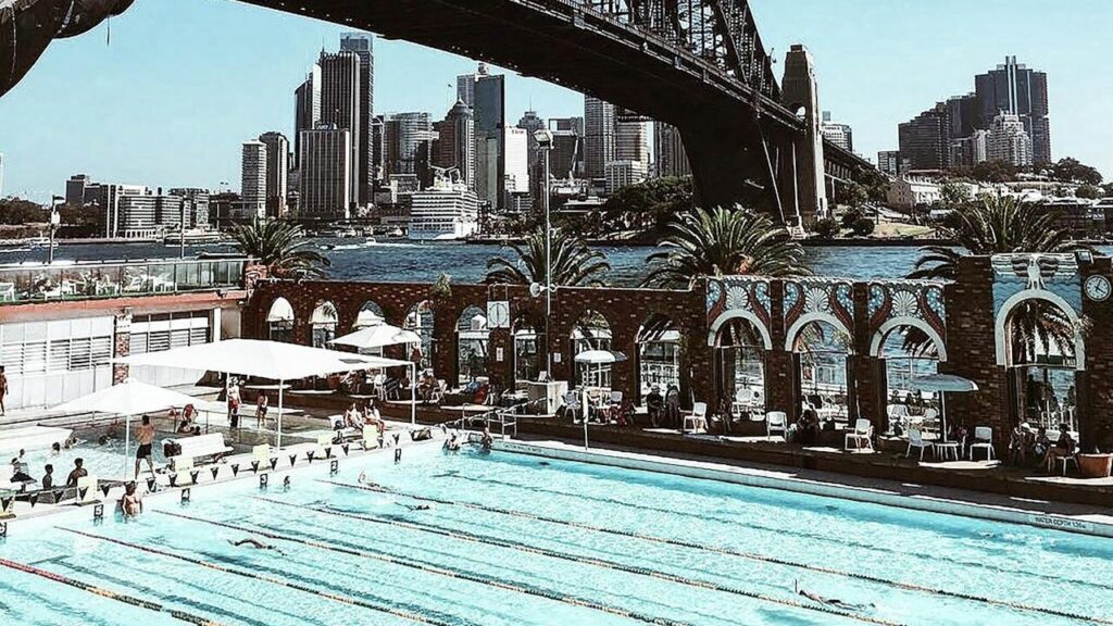 North Sydney Olympic Pool at Milsons Point, overlooked by the harbour bridge. Photo by Vincent Rivaud/ pexels