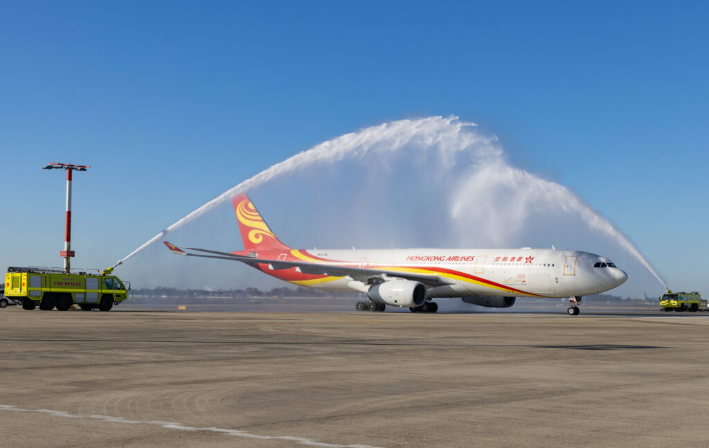 The traditional water cannon salute greets flight HX017 at Kingsford Smith Airport on Saturday. Photo: Sydney Airport