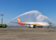 The traditional water cannon salute greets flight HX017 at Kingsford Smith Airport on Saturday. Photo: Sydney Airport