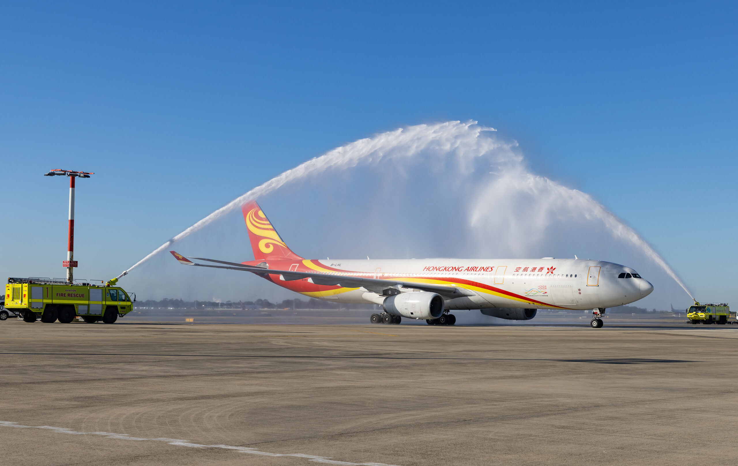 The traditional water cannon salute greets flight HX017 at Kingsford Smith Airport on Saturday. Photo: Sydney Airport