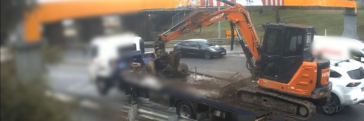An excavator strikes a beam and comes off this truck on Muriel Ave at Rocklea, SEQ, on April 14, 2025. Image: Qld Rail