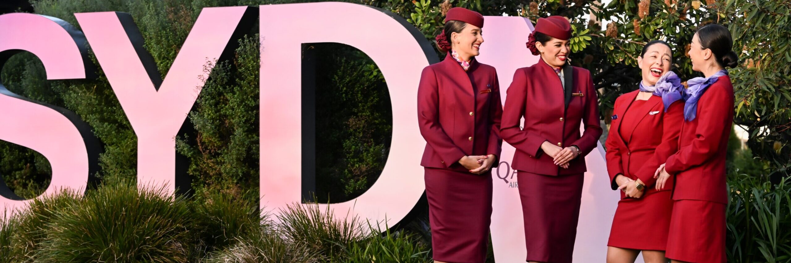 Virgin Australia and Qatar Airways cabin crew at the launch of the Doha service on June 12, 2025. Photo: James Morgan/Getty (supplied)