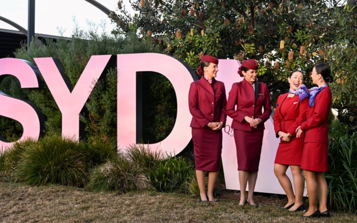 Virgin Australia and Qatar Airways cabin crew at the launch of the Doha service on June 12, 2025. Photo: James Morgan/Getty (supplied)