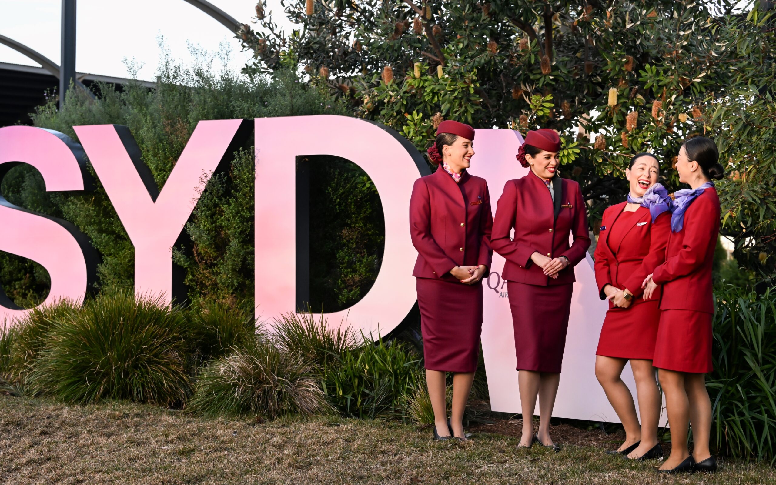 Virgin Australia and Qatar Airways cabin crew at the launch of the Doha service on June 12, 2025. Photo: James Morgan/Getty (supplied)