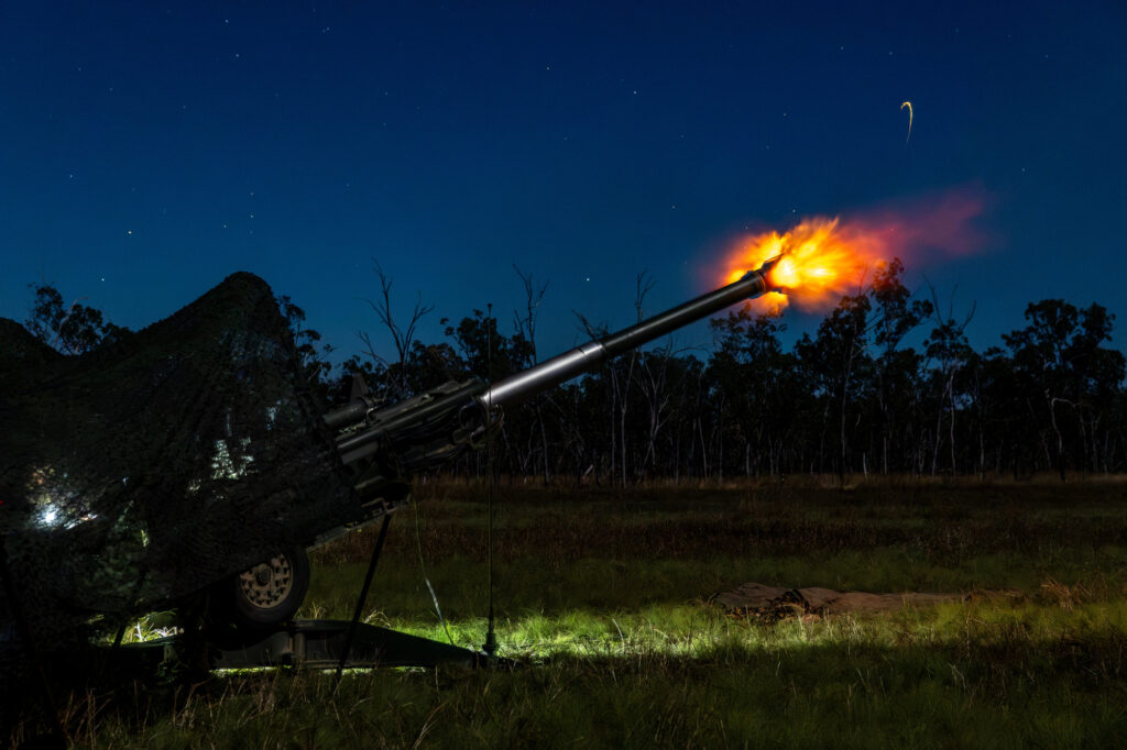 Gunners from 1st Regiment Royal Australian Artillery fire the M777A2 howitzer during night live-fire activity at Shoalwater Bay, Queensland, as part of preparation for Exercise Talisman Sabre 2025. . Photo: © Department of Defence