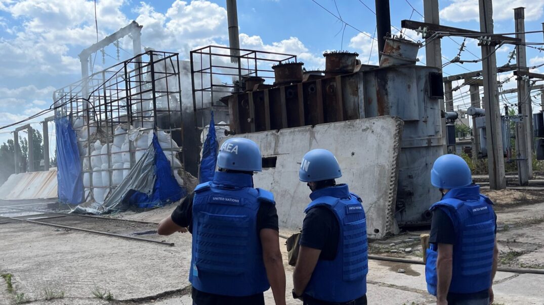 FILE …. an IAEA team at a damaged electrical sub-station in Enerhodar in June last year . Photo: IAEA