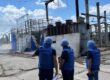 FILE …. an IAEA team at a damaged electrical sub-station in Enerhodar in June last year . Photo: IAEA