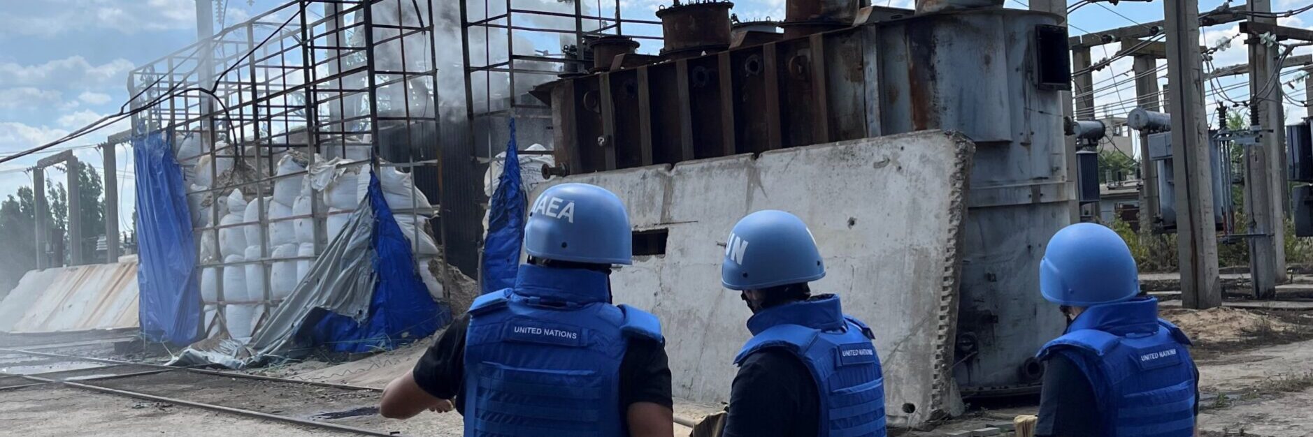 FILE …. an IAEA team at a damaged electrical sub-station in Enerhodar in June last year . Photo: IAEA