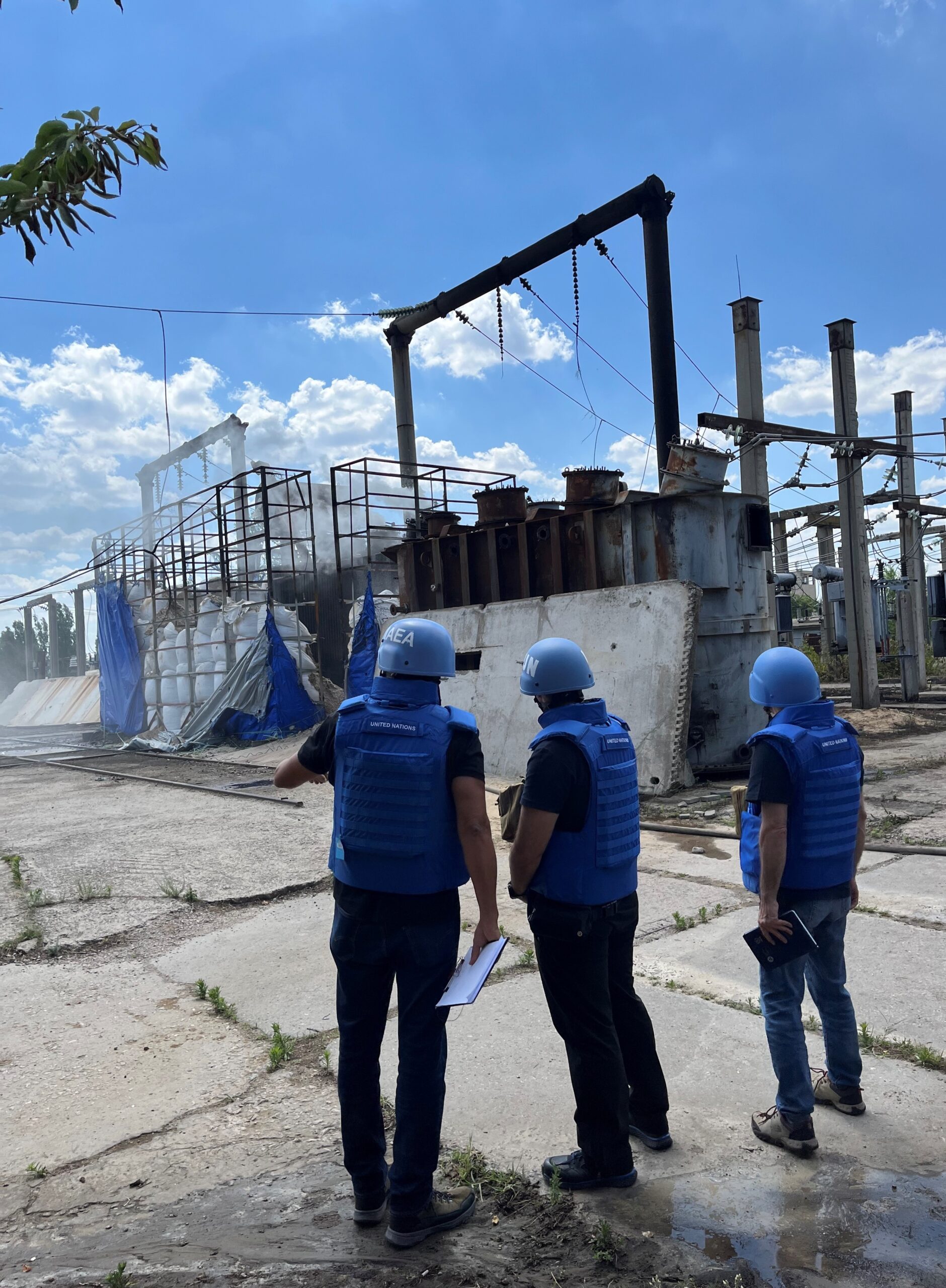 FILE …. an IAEA team at a damaged electrical sub-station in Enerhodar in June last year . Photo: IAEA