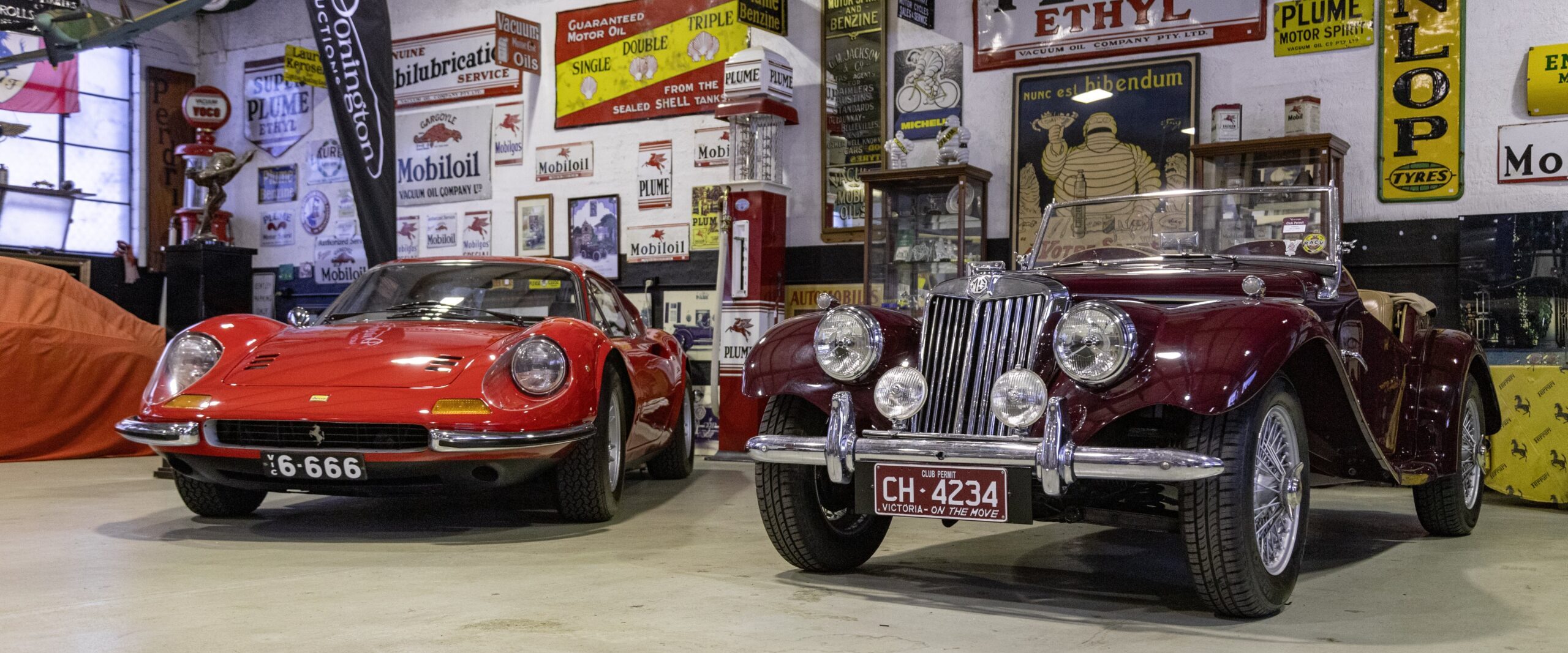The plate on the Ferrari Dino, which were sold separately, and the 1955 MG TF 1500 roadster. Photo: Donington Auctions