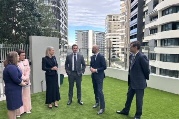Mirvac officials and government guests on a tour of LV Anura at Newstead. Photo: supplied/Mirvac