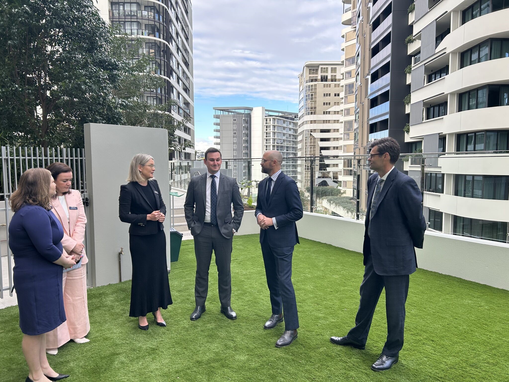 Mirvac officials and government guests on a tour of LV Anura at Newstead. Photo: supplied/Mirvac