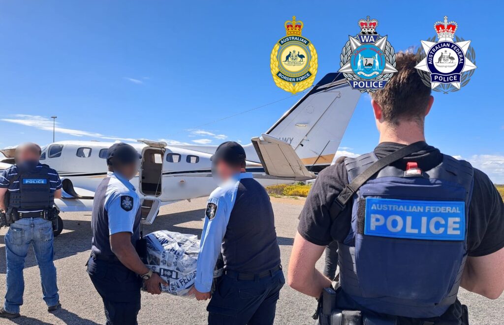 The seized cocaine is transferred from Kalbarri. Photos: AFP