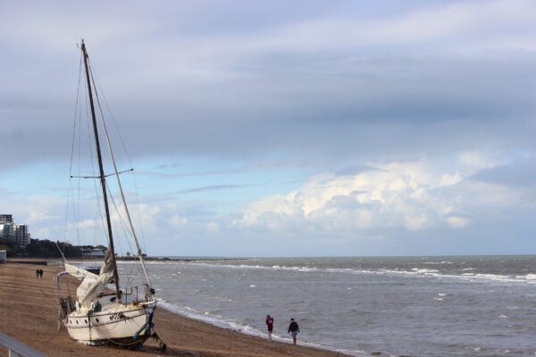 The damaged yacht stranded at Margate Beach, Redcliffe, on Sunday, August 10, 2025. NB: Name blurred to protect privacy. Photo: ANDREW KACIMAIWAI