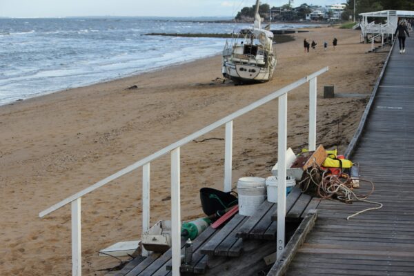 The damaged yacht stranded at Margate Beach, Redcliffe, on Sunday, August 10, 2025. NB: Name blurred to protect privacy. Photo: ANDREW KACIMAIWAI